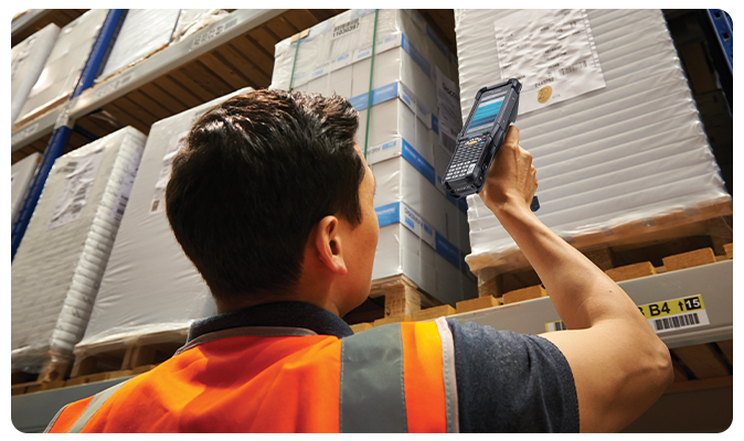 image of a guy using handheld computer